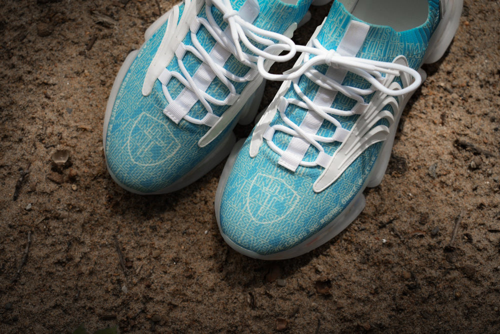 Psalm 23s Quiet Waters colorway, top-down close-up on sand
