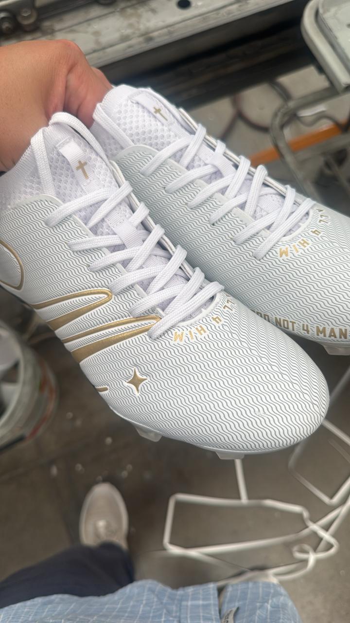 323 Cleats in hand